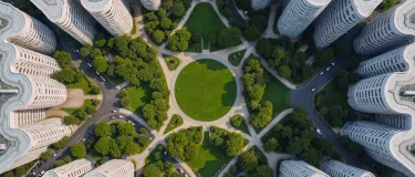 aerial-view-modern-urban-park-surrounded-by-residential-buildings-bd.png
